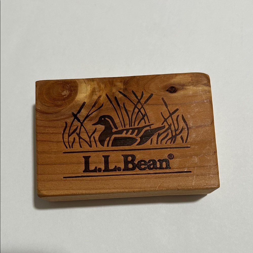 Wooden cedar block featuring L.L. Bean logo and engraved duck design. Set of 6